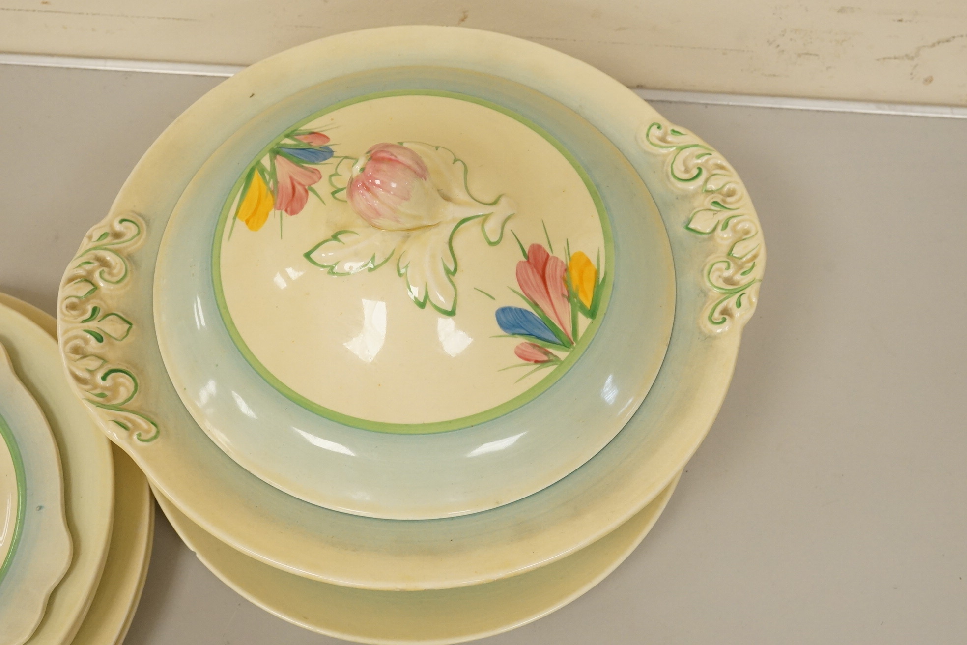 A collection of Clarice Cliff, Newport Pottery and Spring Crocus pattern tableware